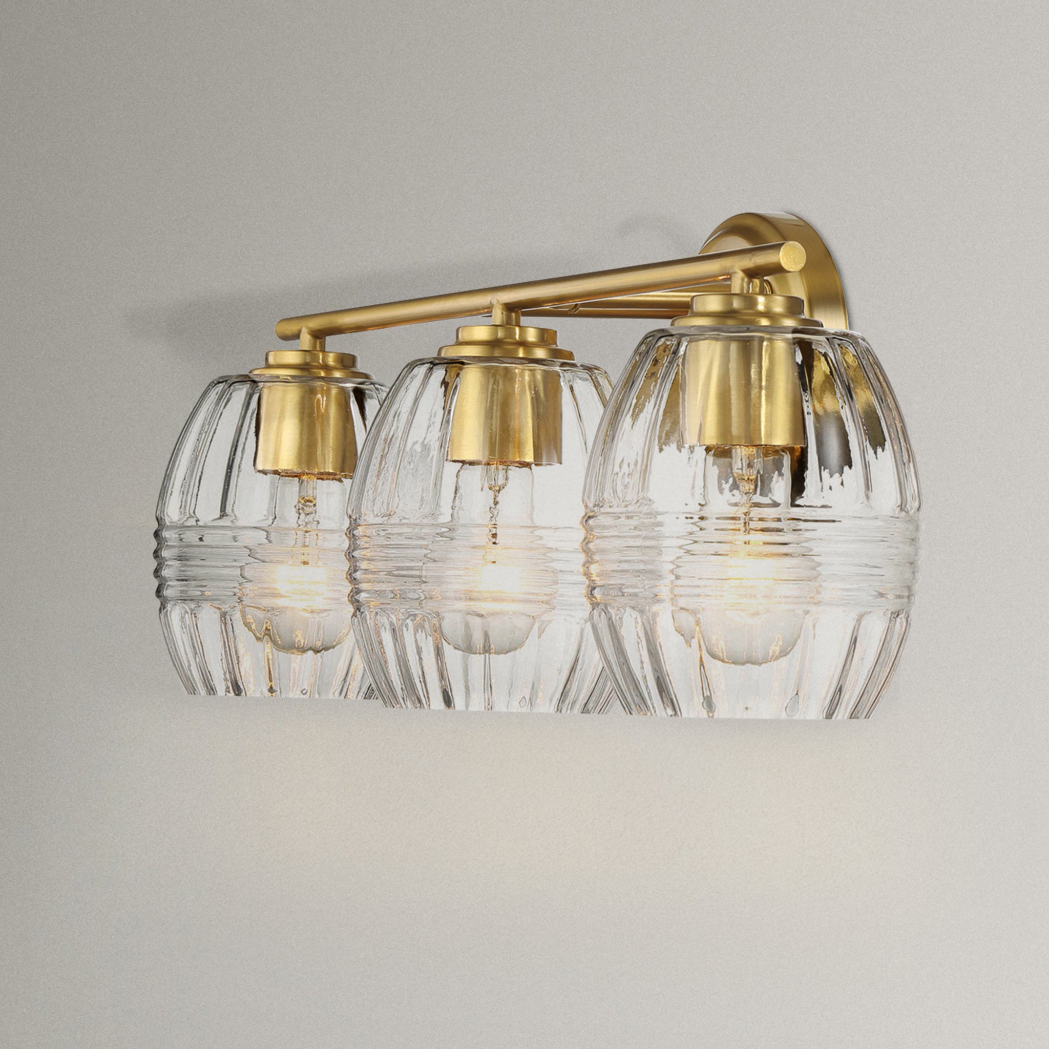 Glimmer Three Lights Vanity With Clear Glass for Bathrooms above Mirror  Wall Lamp - Satin Brass