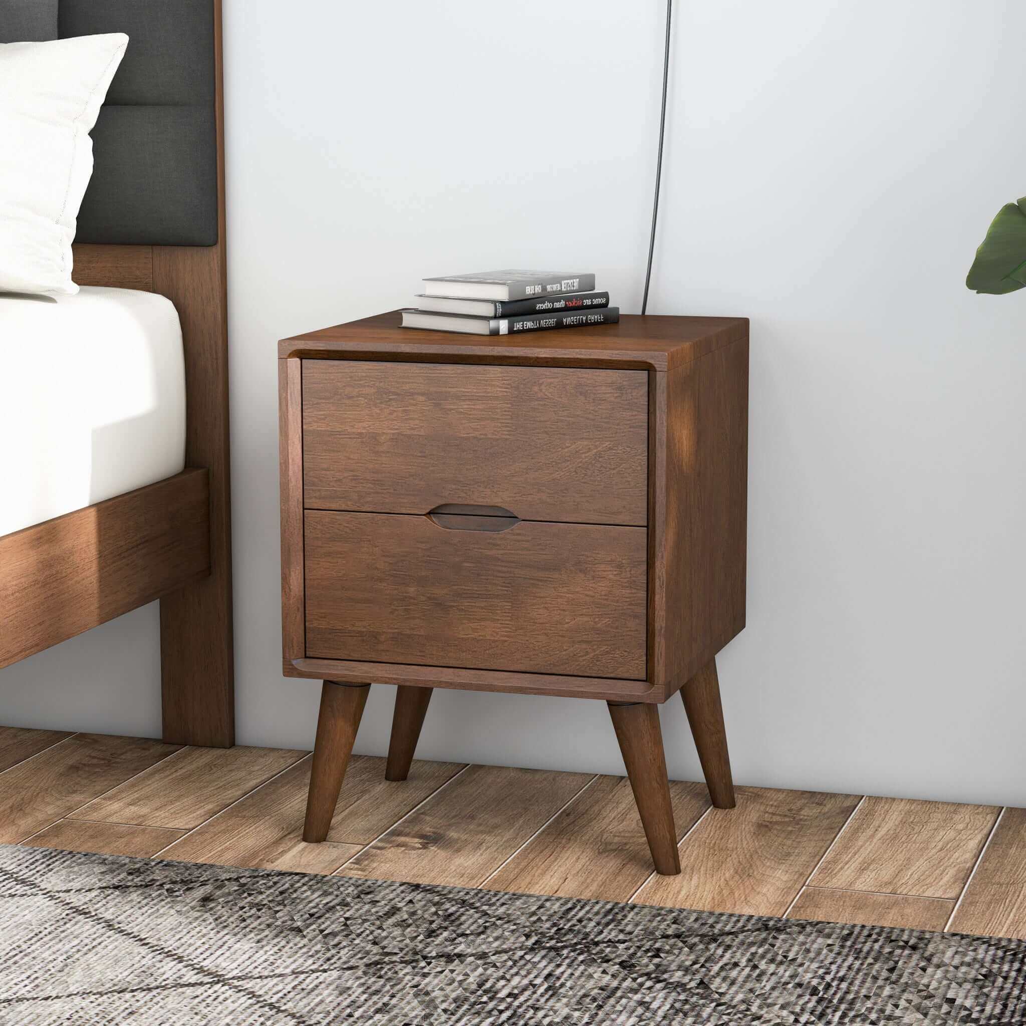 A brown walnut nightstand with two drawers and beveled edges, featuring a modern design with splayed legs.
